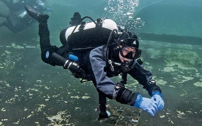 Scuba diver holding a horizontal trim position underwater